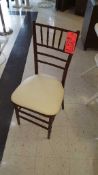 Lot of (111) chiavari, cushioned wood chairs, with chair covers, in warehouse