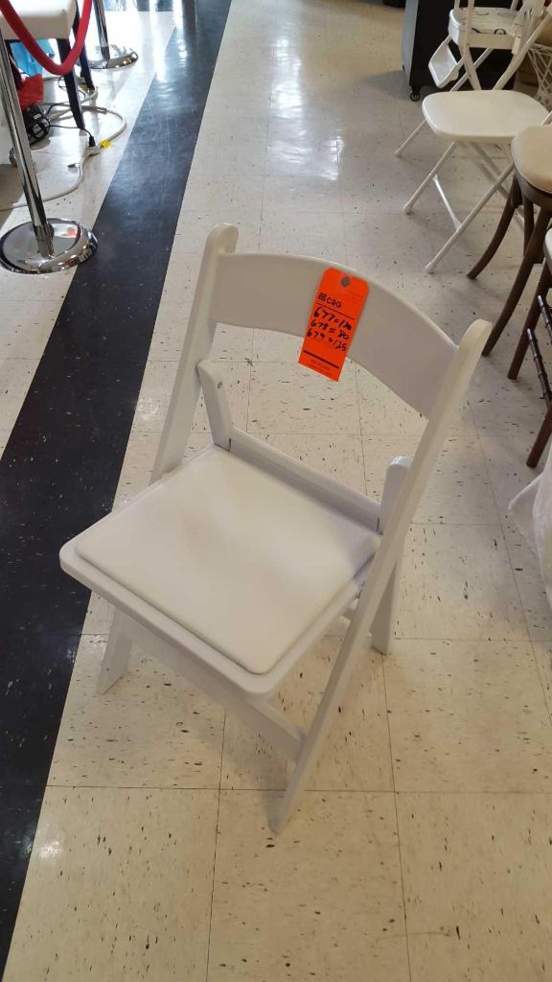 Lot of (80) white wedding, cushioned, folding resin chairs, in store