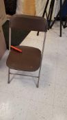 Lot of (75) brown folding chairs. In warehouse