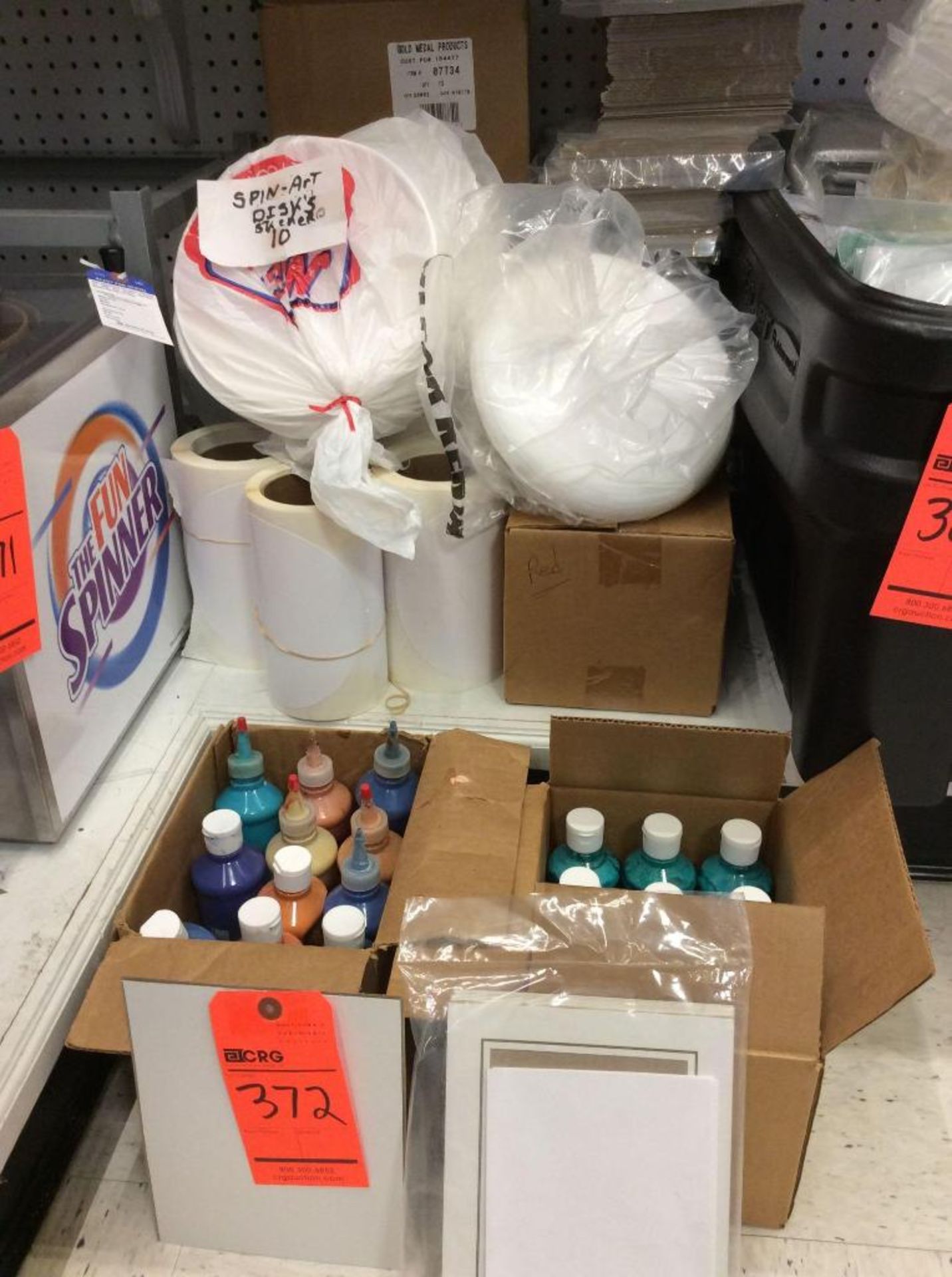 Lot of paint, frisbees and cards for gold medal spin art machines