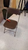 Lot of (75) brown folding chairs. In warehouse