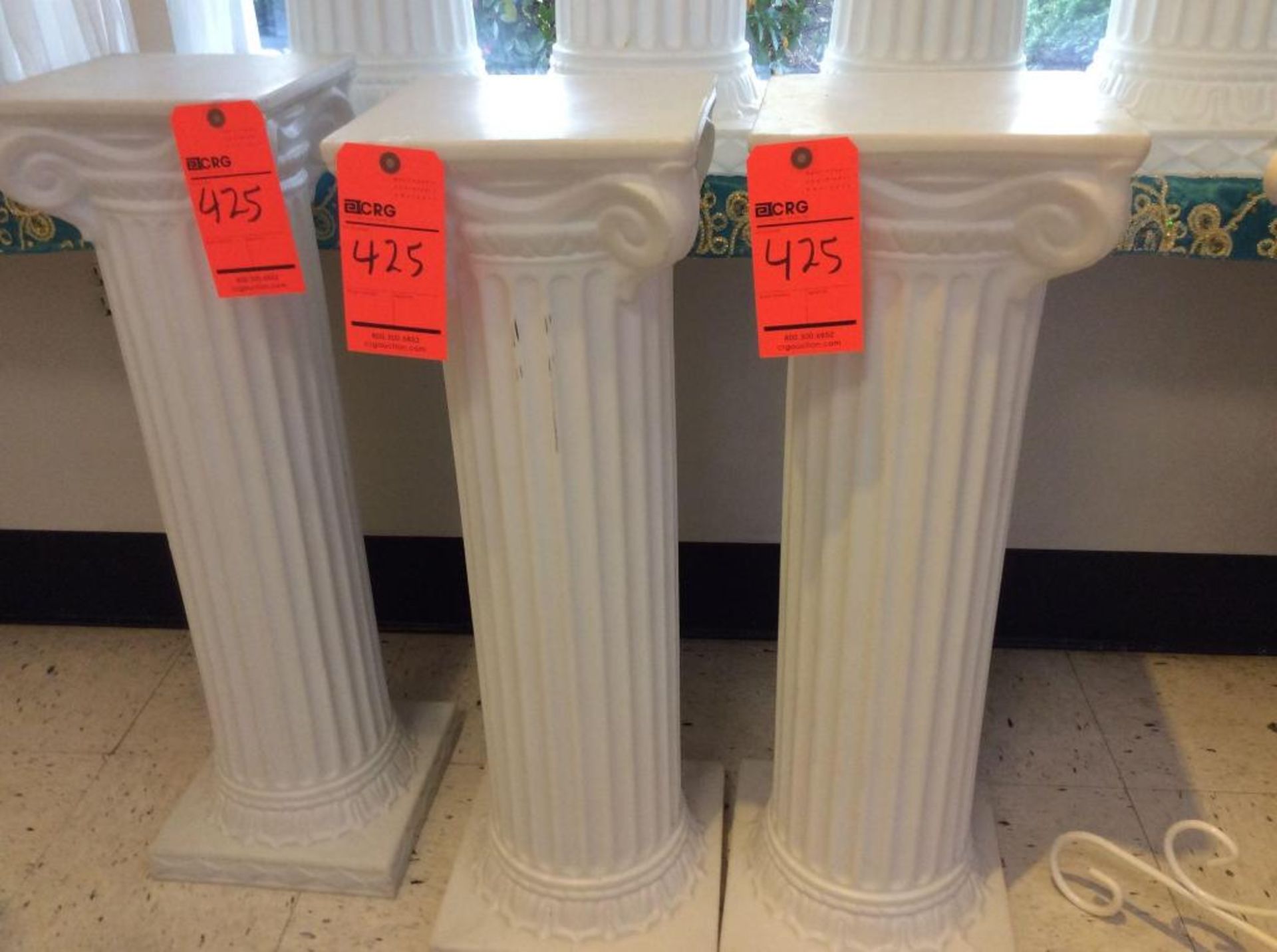 Lot of (8) hard plastic white event columns, (4) at 48", and (4) at 40"