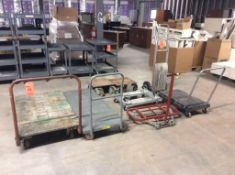 Lot of material handling items, including hand truck, platform trucks, and dollies