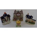 A Yorkshire style pottery money box, in the form of a house, 16 cm high,