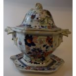 An ironstone tureen and cover with stand, with printed and painted floral decoration,