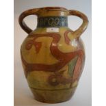 A Continental pottery two handled vase, decorated a face, the neck inscribed Droomery,