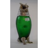 A green glass claret jug, in the form of an owl, with plated mounts,
