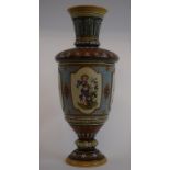 A Mettlach pottery vase, decorated figures and with stylised flowers and foliage decoration,