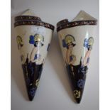 A pair of Art Deco style pottery wall pockets, decorated ladies, 30.