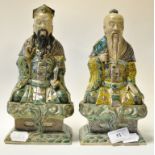 A pair of Chinese sages, seated (slight loss), 23.