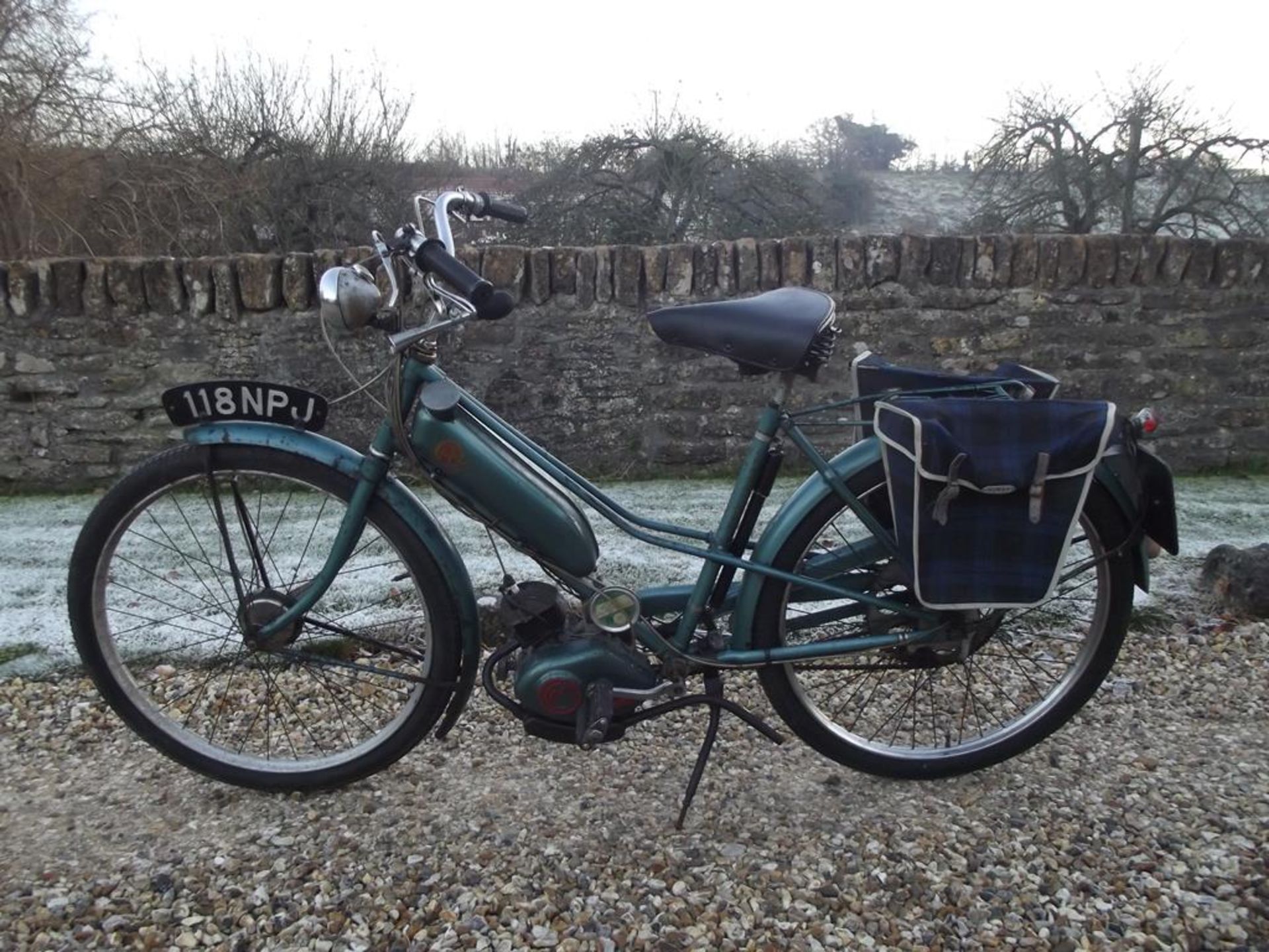 A 1960 Norman Cyclemate, registration number 118 NPJ, green.