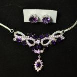 A silver, amethyst and cubic zirconi nec