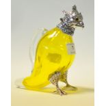 A yellow glass claret jug, in the form o