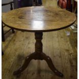 A 19th century oak tripod table, 80 cm d