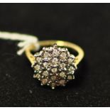 A 9ct gold and diamond cluster ring, app