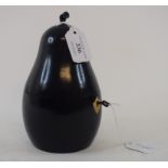An ebonised tea caddy, in the form of a