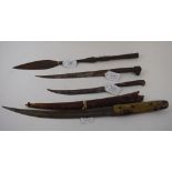 An ethnic knife, two others, and a spear