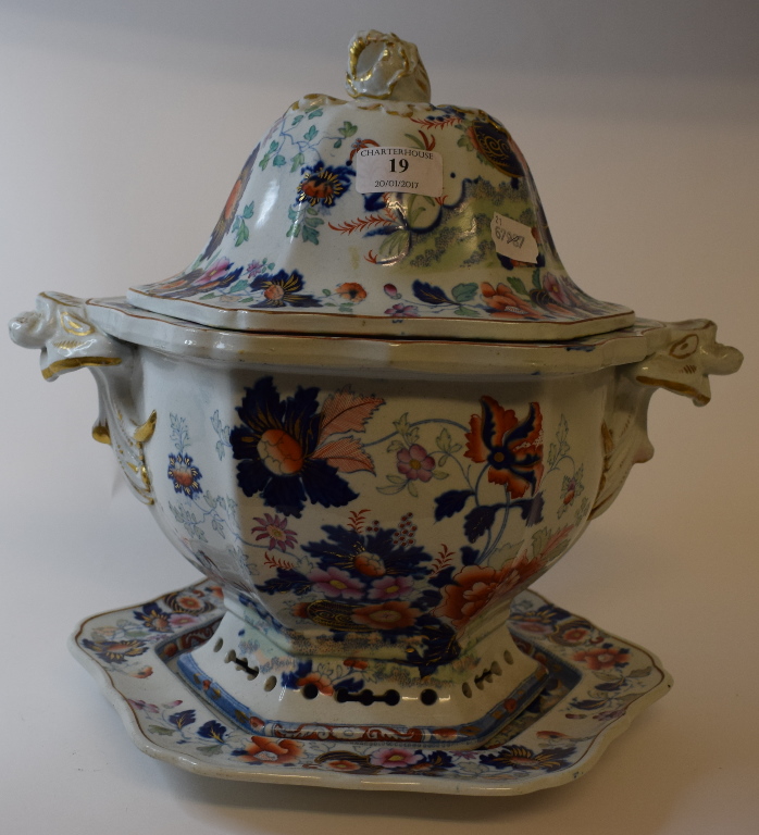 An ironstone tureen and cover with stand