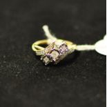 A 9ct gold and three stone diamond ring,