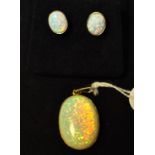 A 9ct gold and Gilson opal pendant, and