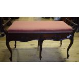 An Edwardian carved mahogany duet stool,