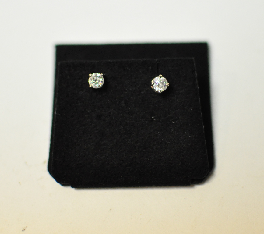 A pair of 18ct gold and diamond solitair