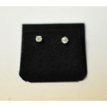 A pair of 18ct gold and diamond solitair