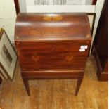 A mahogany dome top casket, inlaid with