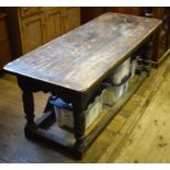 An oak refectory table, the frieze carve