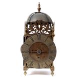 A brass lantern clock, the dial signed T