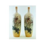 A pair of pottery vases, decorated flowe