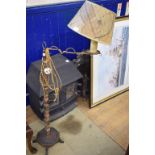 A folk art style standard lamp, on a wro