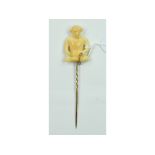 A stick pin, with a carved ivory Buddha