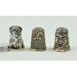 A silver novelty thimble, in the form of