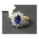 An 18ct gold, oval sapphire and diamond