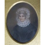 An oval half length portrait miniature,