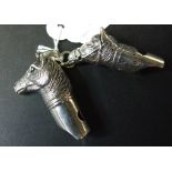 Two silver novelty horse whistles