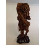 A Chinese root carving, of a sage, 29 cm