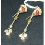 A pair of yellow coloured metal, ruby an