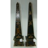 A pair of metal obelisks, with chinoiser