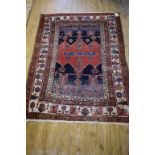 A Persian rug, with geometric motifs on