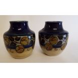 A pair of Royal Doulton stoneware vases,