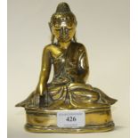 A bronze Buddha, seated (lacks a finger