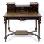 A late 19th century ebonised desk, havin