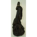 After Cavallino, a carved wood figure, b
