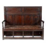 A 17th century oak and elm box settle, w