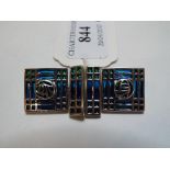 A pair of Charles Rennie Mackintosh style silver coloured metal and enamel cufflinks,