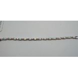 A silver coloured metal and opal bracelet,