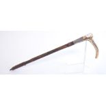 A Brigg riding crop, with silver collar, marks rubbed,