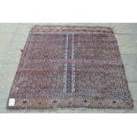 An Afghan style rug, with geometric motifs,